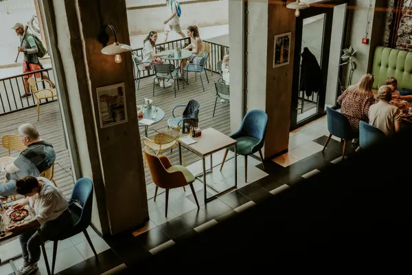 Guests at tables in a busy café