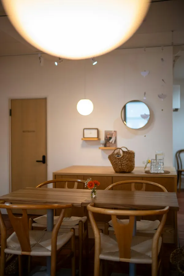 A calm café corner with a wooden table and soft light