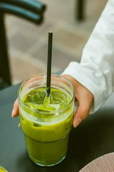 Iced matcha latte in a glass